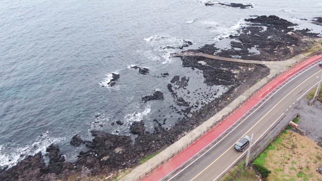 Vast sea stretching out beside the coastal road