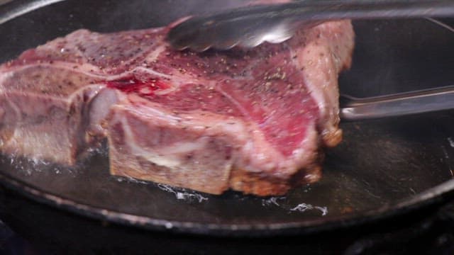 Delicious Steak Grilled on a Hot Iron Plate