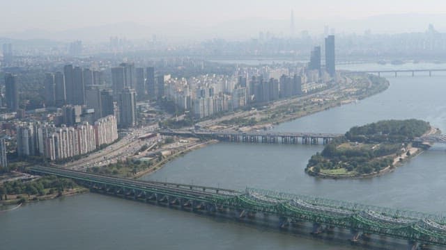 Urban Riverfront with Bridges and High-rises