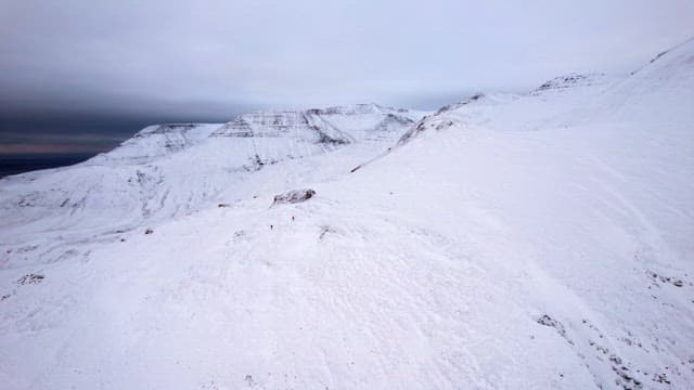 Snow-covered mountain landscape at dusk