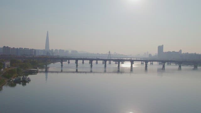 Calm river with a city skyline