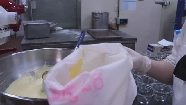 Piping bag full of creamy bread batter