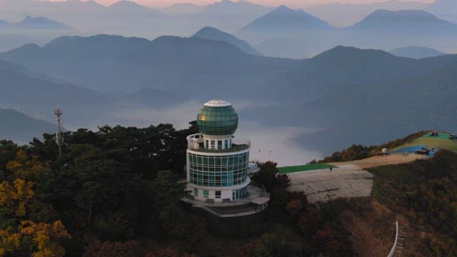 Observatory among autumn mountains at dawn