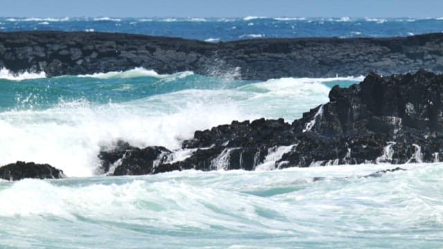 Waves crashing on rocky shore