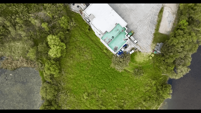 View of a green landscape with a building