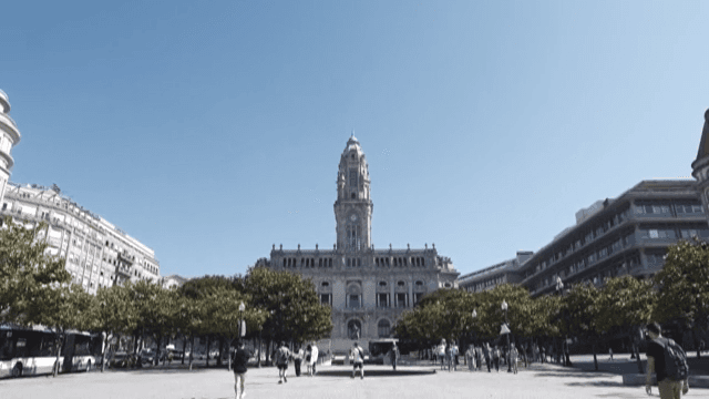 Square with City Hall and People Walking on a Sunny Day