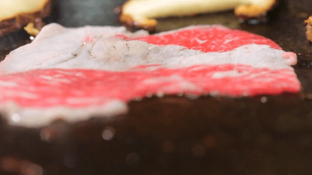 Sizzling beef brisket on a grill