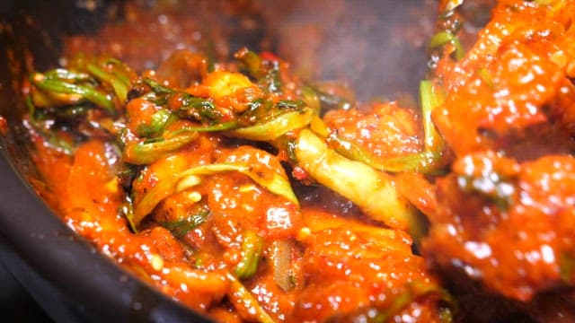 Spicy Stir-fried Webfoot Octopus with Green Onions and Sesame Seeds