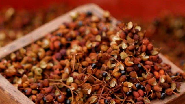 Spices falling onto a wooden surface