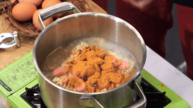 Ramyeon with sausage being prepared
