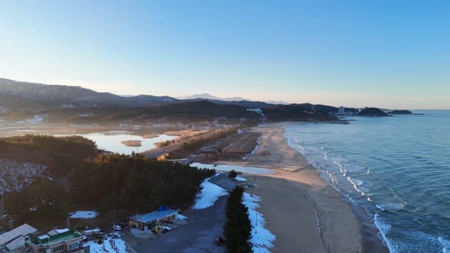 Serene beach with distant mountains
