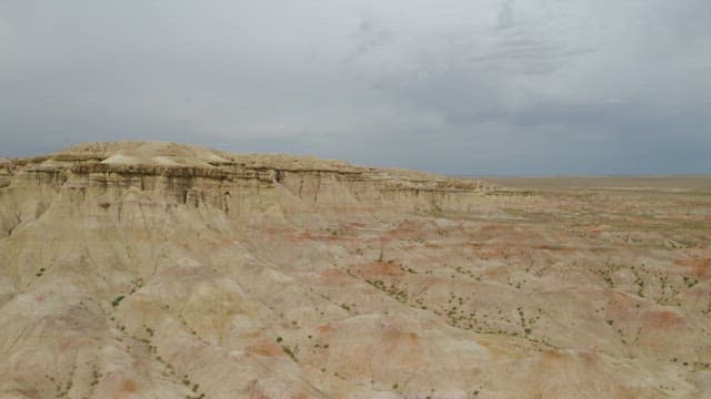 Expansive Badlands Under Overcast Skies