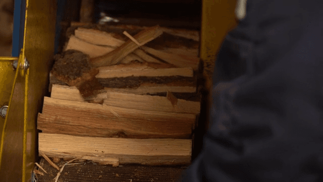 Wood being processed in a machine
