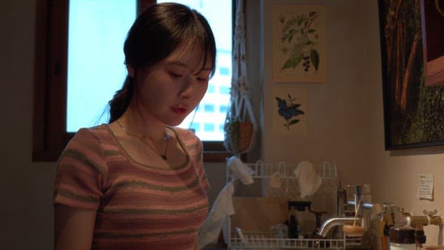 Woman checking the seasoning in the kitchen