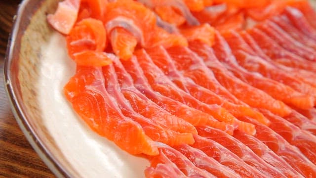 Freshly sliced salmon sashimi on a plate