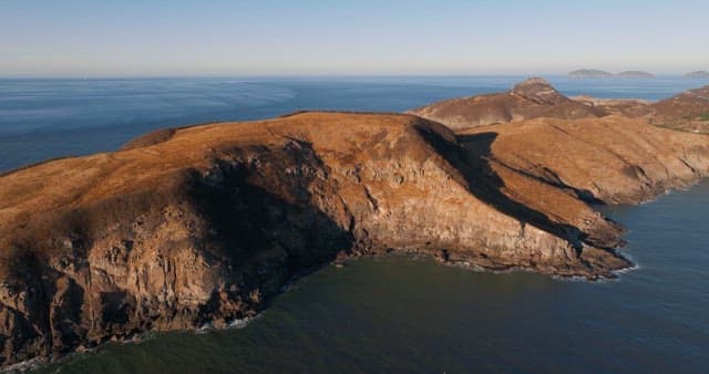 Serene Coastal Landscape with Hills and Sea