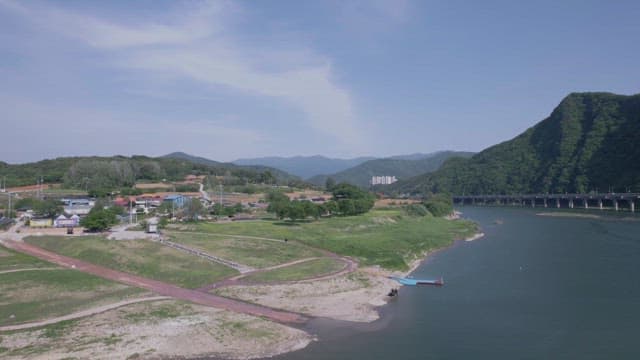 Rural Area beside Scenic River with Bridge