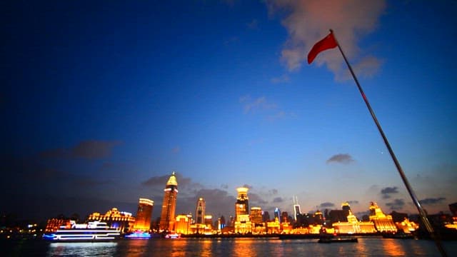 Dusk View of City Skyline with Illuminated Buildings