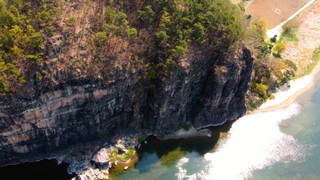 Scenic river with rocky cliffs and trees