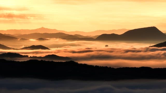 Mountains with clouds at sunrise