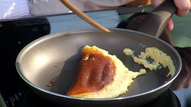 Soufflé pancakes cooked in a frying pan