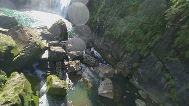 Majestic waterfall cascading into a river
