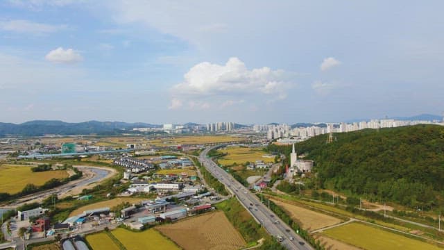 Rural landscape with fields and a city