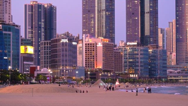Sunset at a bustling urban beachfront