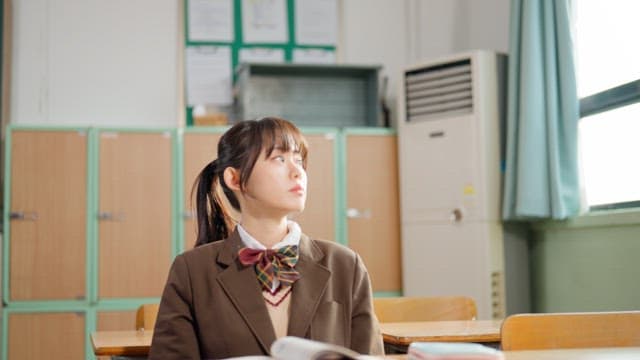 Student stretching in a classroom