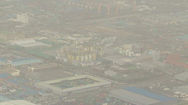 Aerial View of Industrial Cityscape with Dense Factories