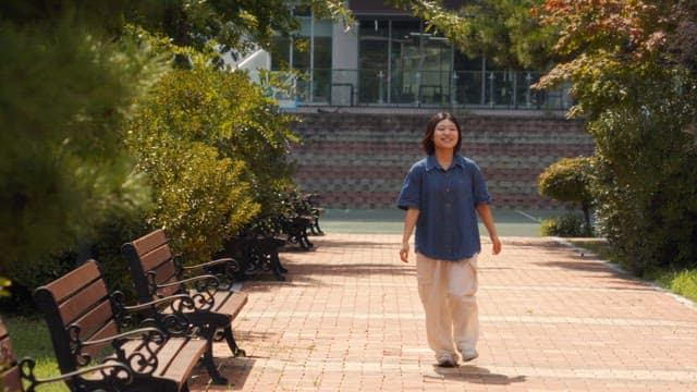 Woman joyfully running in a park