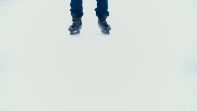Person ice skating at a rink