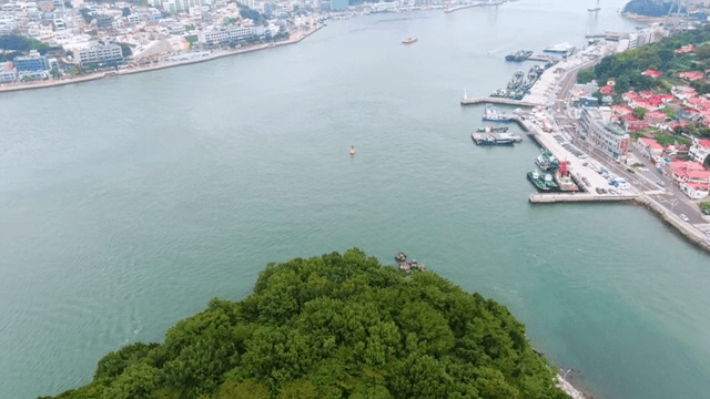 Coastal city with island and buildings