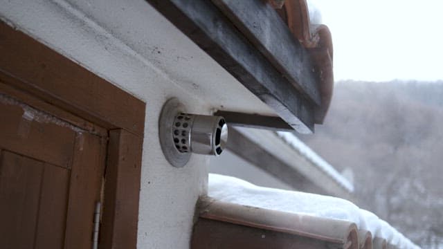 Exhaust Pipe on Snow-Covered Roof