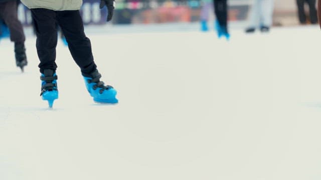 People ice skating at a rink