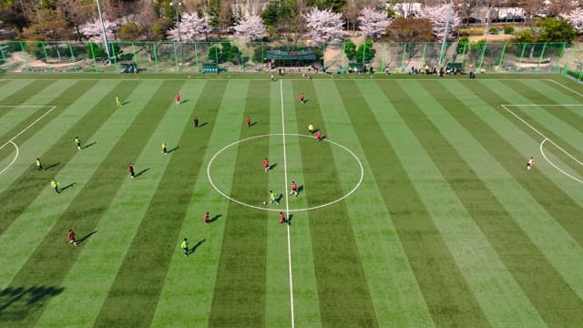 Aerial View of a Soccer Match in Spring