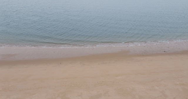 Waves Crashing on Peaceful Sandy Beach