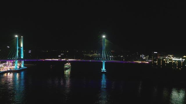 Colorful lights on a bridge at night