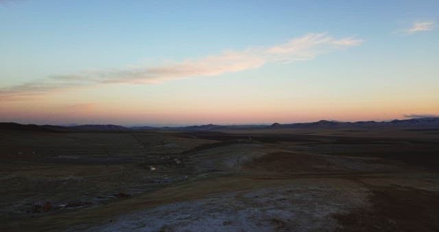 Vast landscape at sunset with distant hills