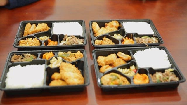 Assortment of Korean Dishes in Meal Boxes