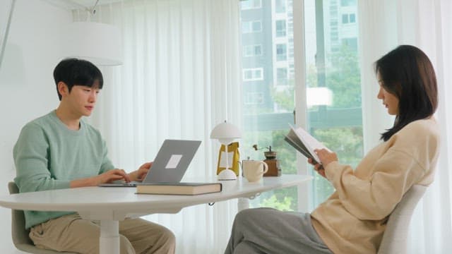 Couple sitting and relaxing in a bright living room