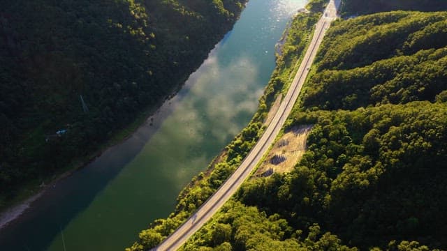 Aerial View of Road Through Verdant Landscape