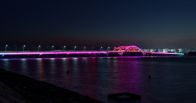 Night view of a bridge with colorful lights