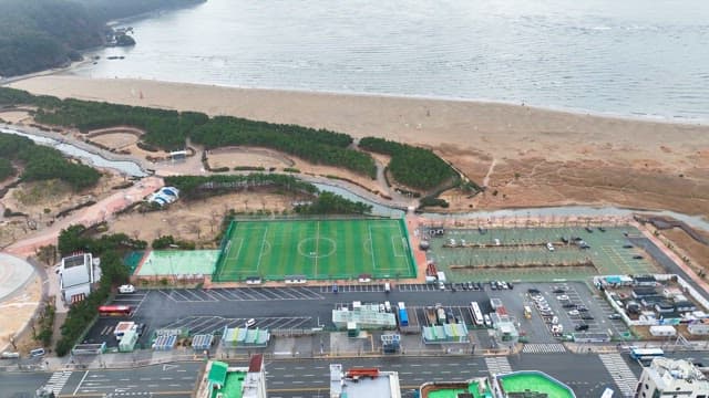 View of a beach and sports field