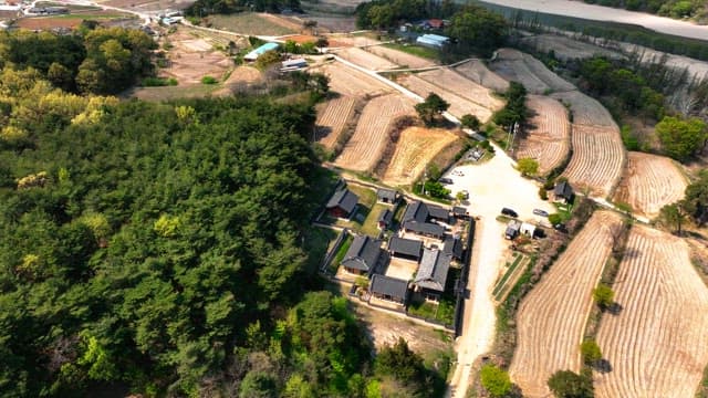 Traditional Korean house surrounded by farmlands