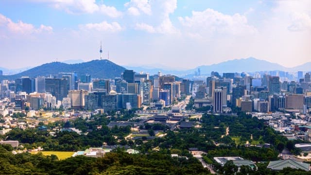 Scenic view of the city skyline with mountains in the background