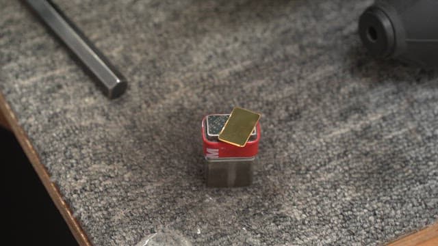 Small metal object on a table