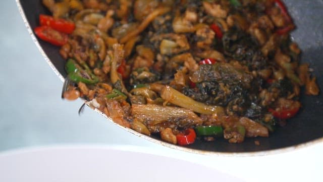 Freshly cooked dried radish greens stir-fried in a frying pan