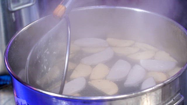 Bread starter boiling in a pot