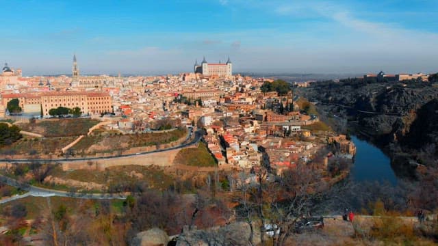 Toledo with a river and buildings